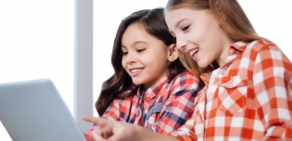 two elementary school girls working on an assignment