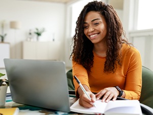Teacher working on laptop