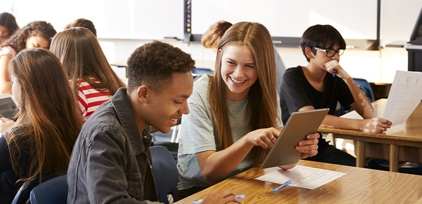 two high school students working together