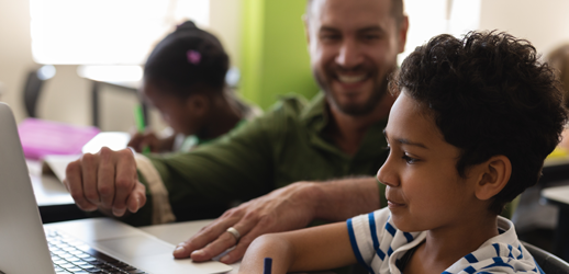 student and teacher on laptop
