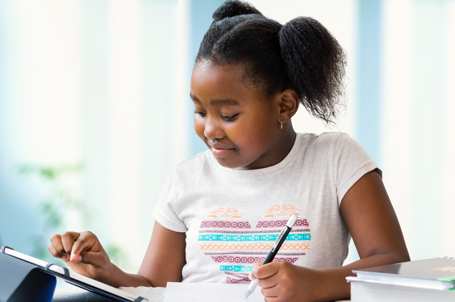 Student doing assignment on tablet