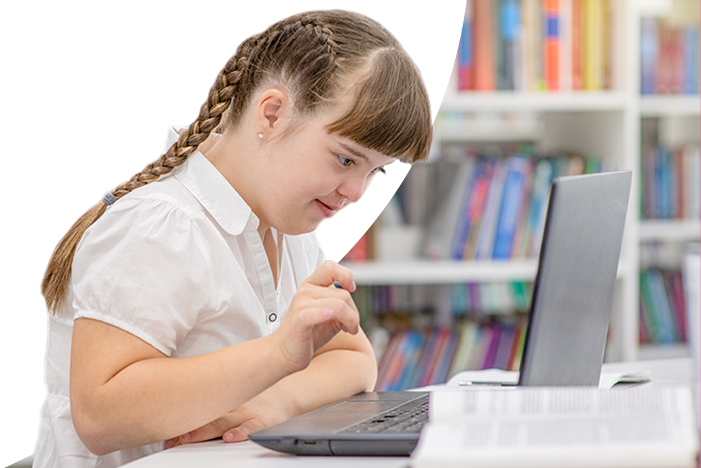 High school student typing on a computer keyboard.