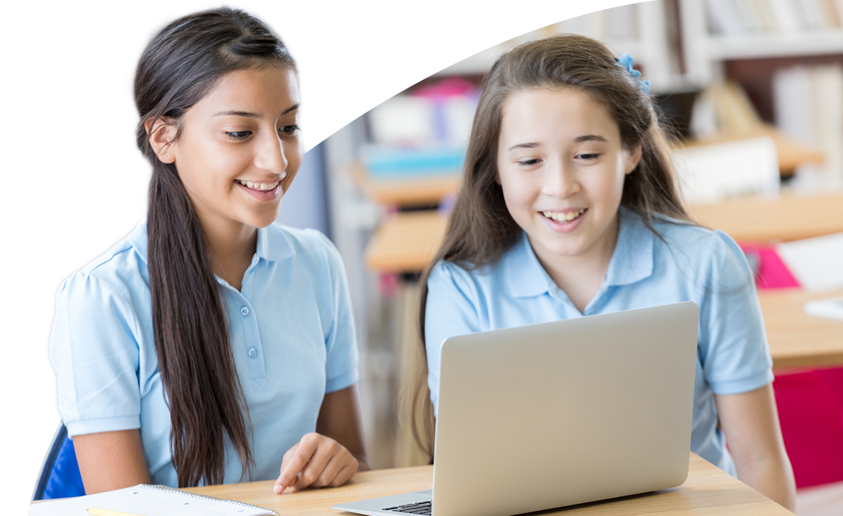 students working together on a laptop