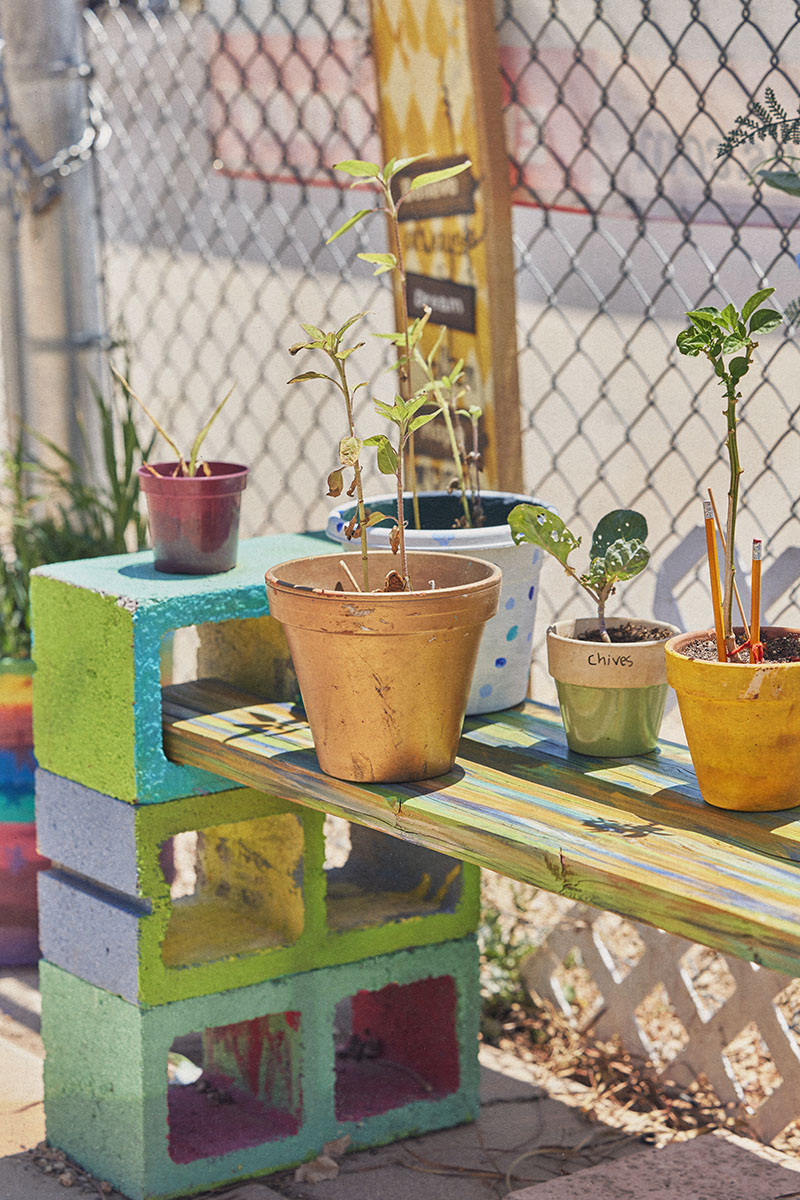 Student sitting on the floor, looking up in awe.