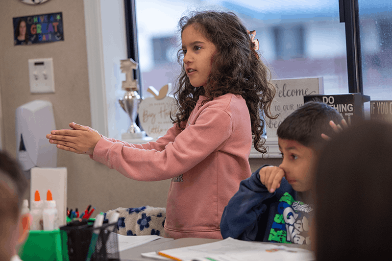 Elementary student engaging in an interactive lesson on a laptop