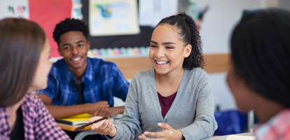 Student raising her hand in class