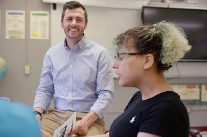 A student and teacher discussing class work